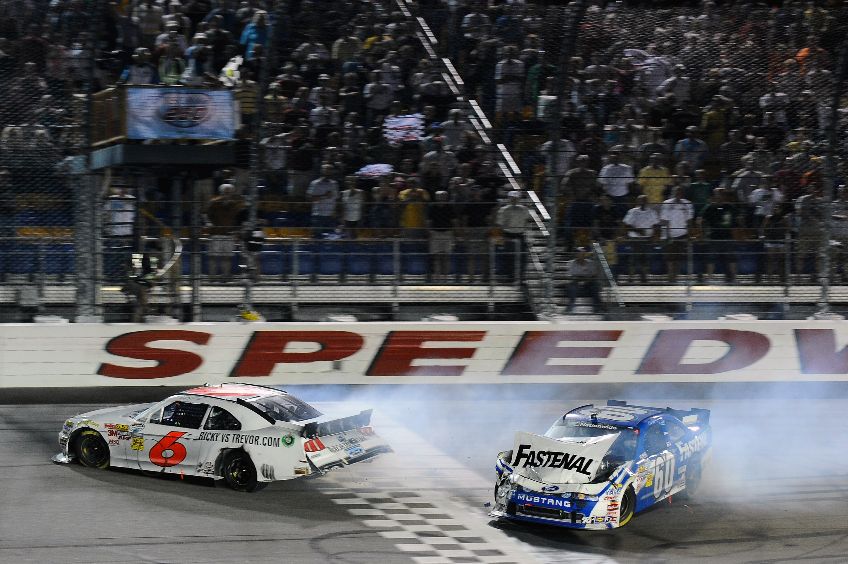 Ricky Stenhouse Jr., driver of the No. 6 RickyvsTrevor.com Ford crosses the finish line to win, ahead of Carl Edwards, driver of the No. 60 Fastenal Ford, after colliding on the final lap during the NASCAR Nationwide Series U.S. Cellular 250 at Iowa Speedway on Aug. 6 in Newton, Iowa. Credit: Jason Smith/Getty Images for NASCAR